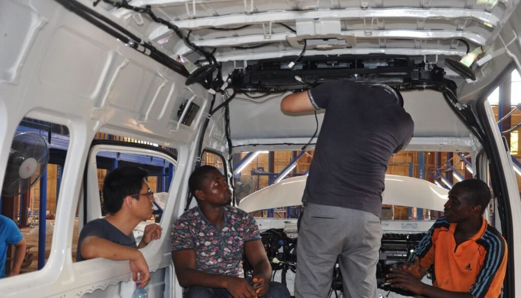 TJ Autos engineer working with the local assembly team